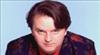 Paul Merton in a colourful suit