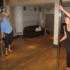 Dev learns some pole dance moves