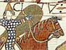 Norman soldiers riding into battle