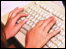 hands  on a keyboard