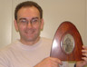 Gary PT Davies with a World War One photograph of his great grandfather - the photo's frame was made by Gary's great grandfather from the tip of an aeroplane propeller