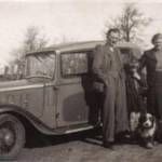 The Austin 10 that we slept in.  Notice Rover, the farm dog.  Notice too the blackout hoods over the headlights